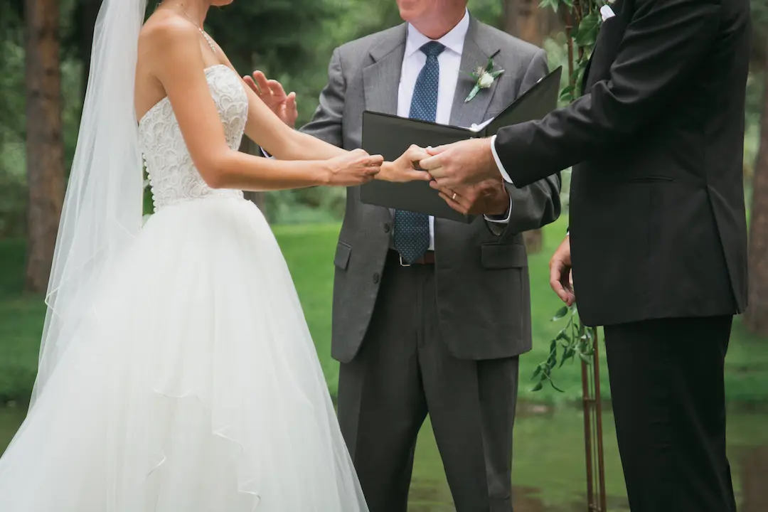 bride and groom holding hands
